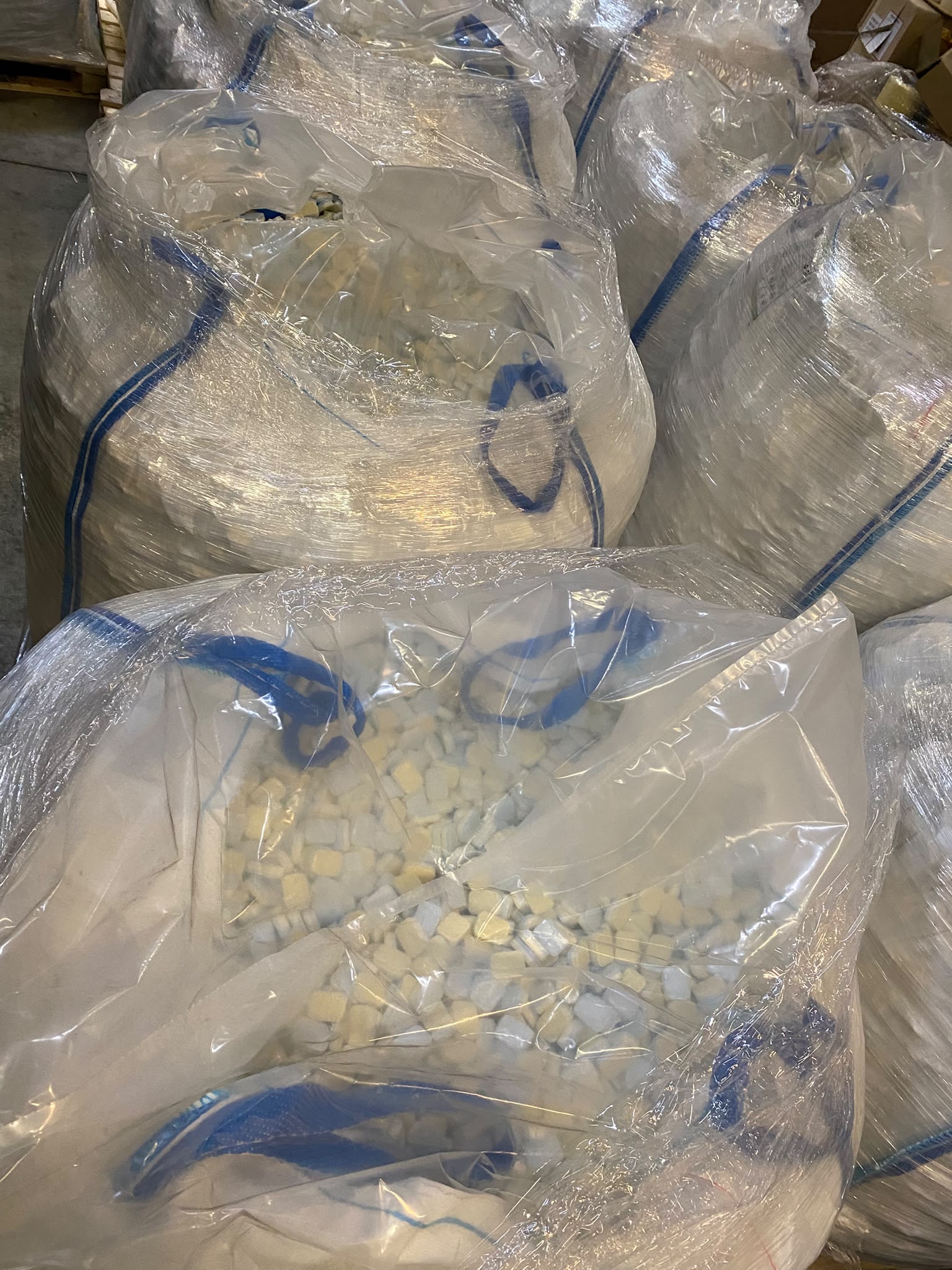 Big bags of dishwasher tablets on pallets